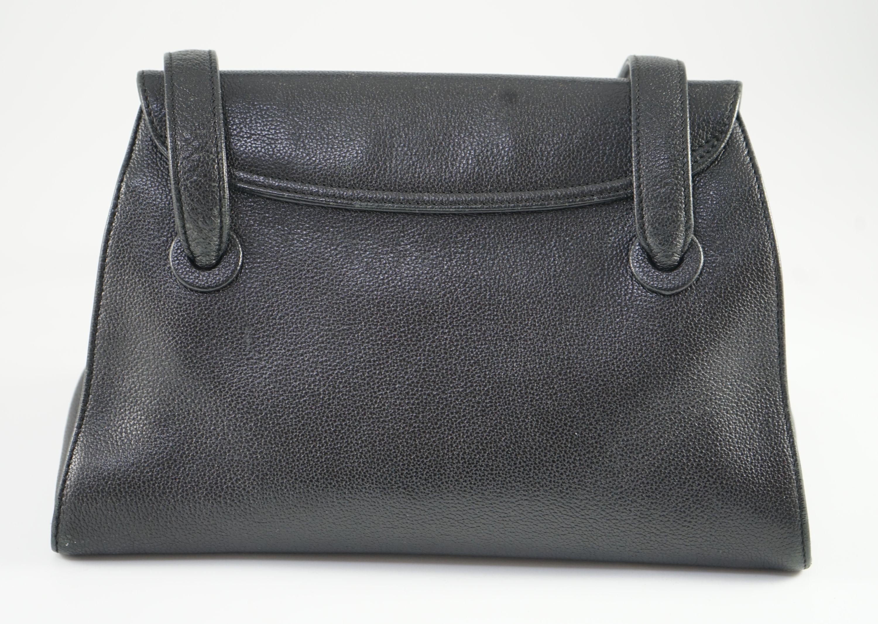 A black Chanel shoulder bag with two straps and Chanel logo lock